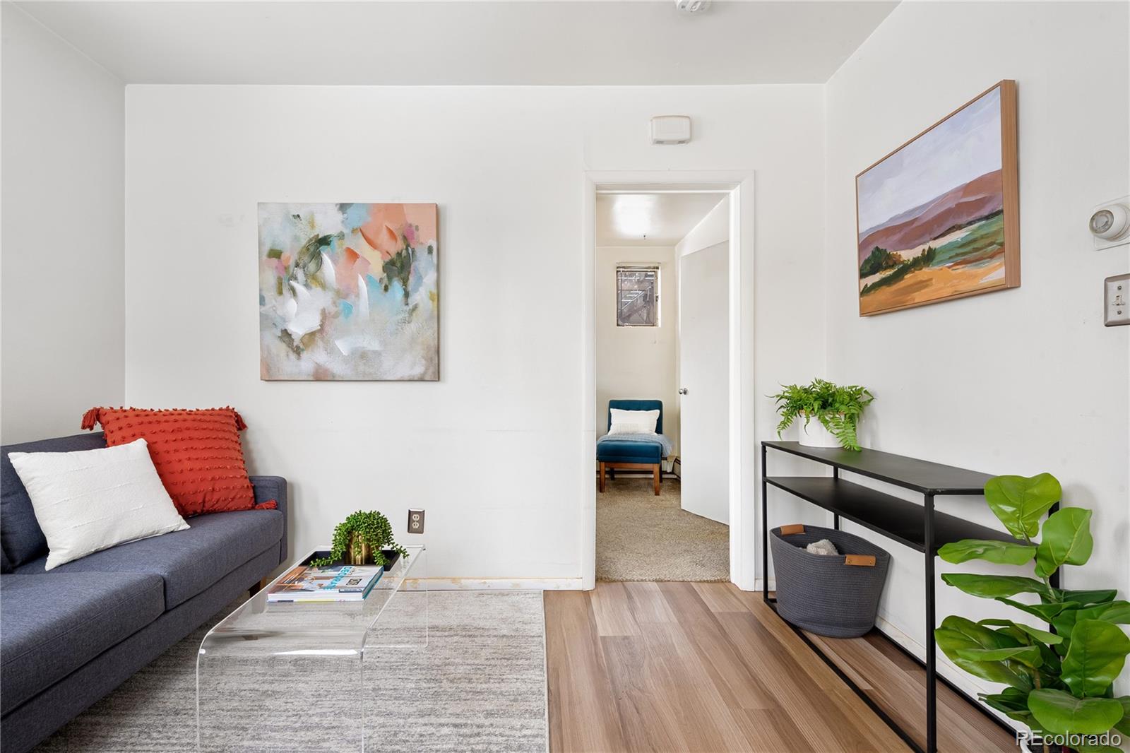 4151 Zenobia Street Denver, CO 80212 - Photo 13 of 31 a living room with furniture and wooden floor
