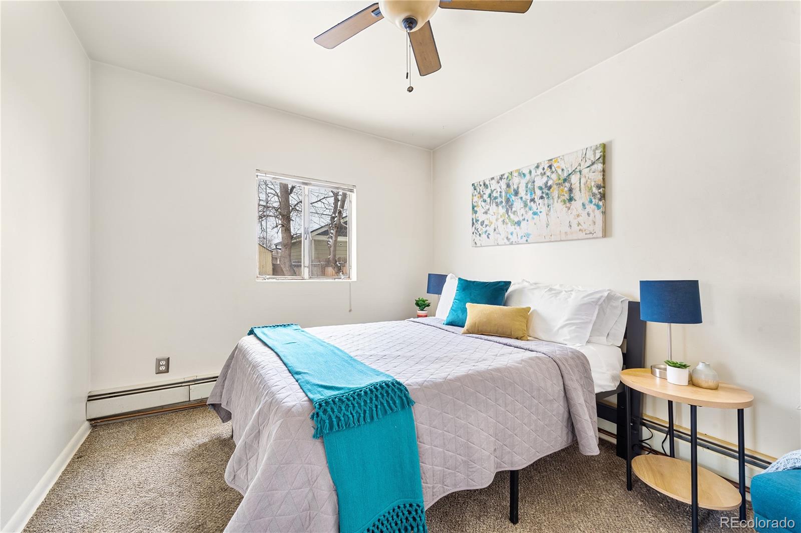 4151 Zenobia Street Denver, CO 80212 - Photo 17 of 31 a bedroom with a bed and a window