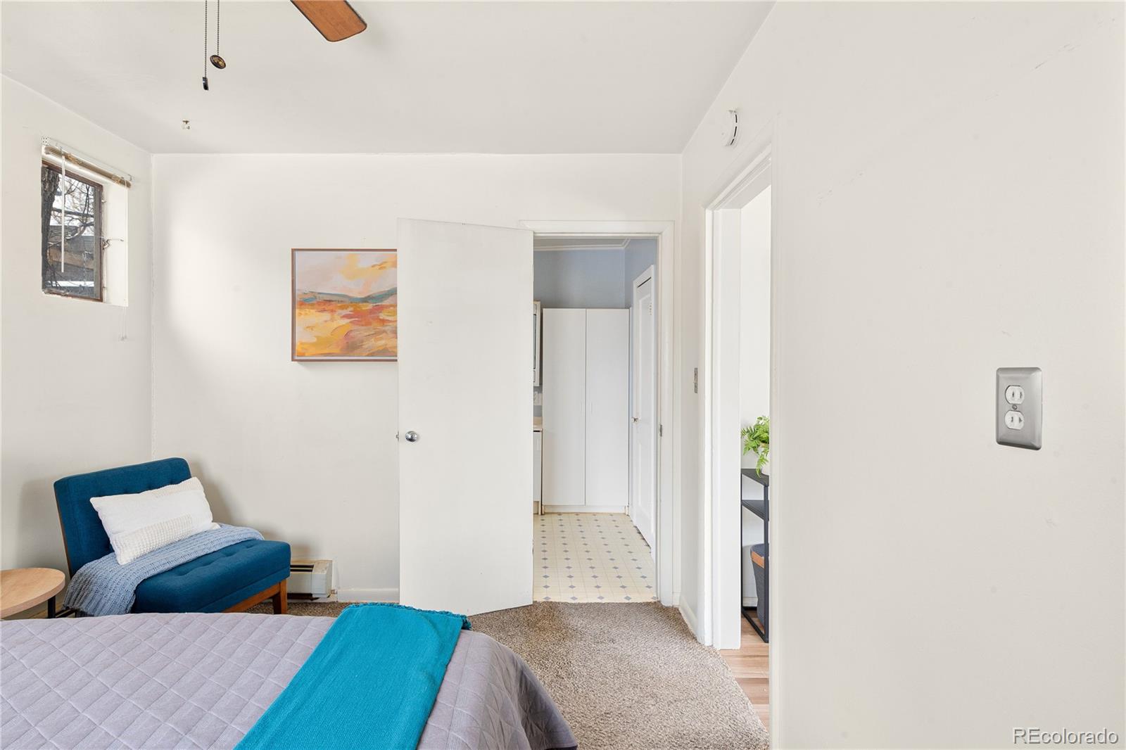 4151 Zenobia Street Denver, CO 80212 - Photo 18 of 31 a bedroom with a bed and a painting on the wall