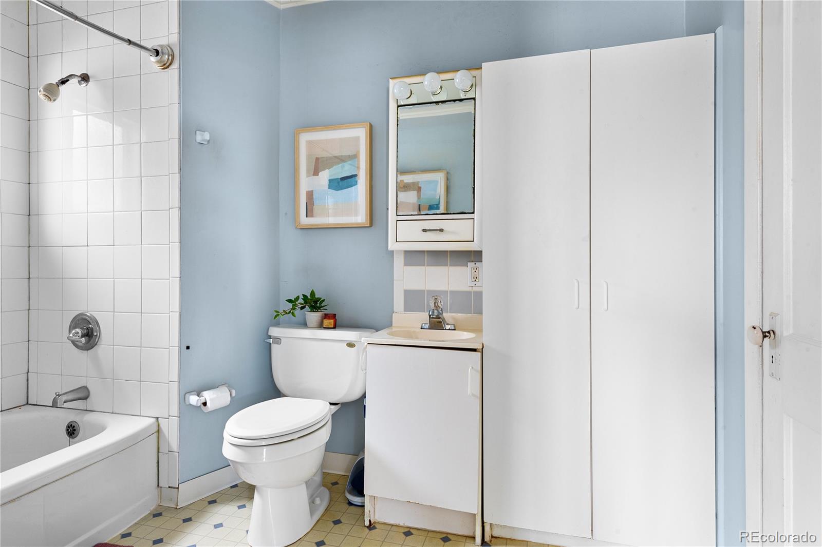 4151 Zenobia Street Denver, CO 80212 - Photo 19 of 31 a bathroom with a toilet and a bathtub