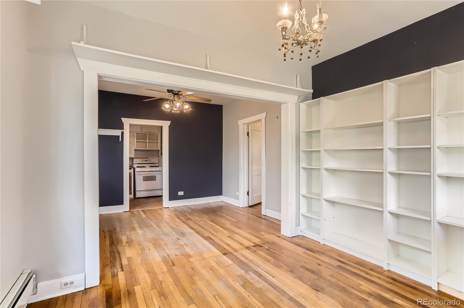 4151 Zenobia Street Denver, CO 80212 - Photo 23 of 31 a view of an empty room with a cabinet