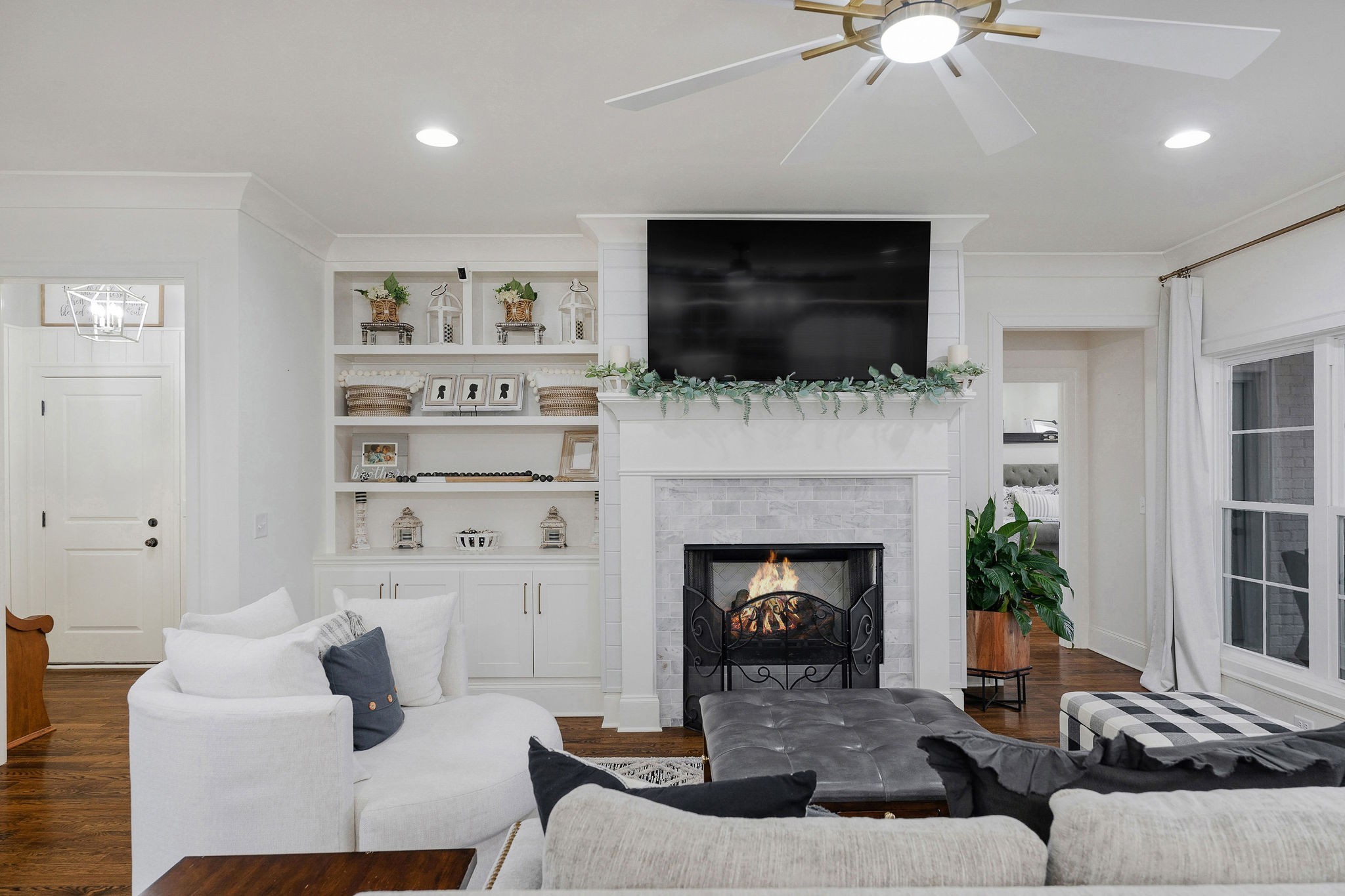 2945 Siegel Road Murfreesboro, TN 37129 - Photo 12 of 59 a living room with furniture a flat screen tv and a fireplace