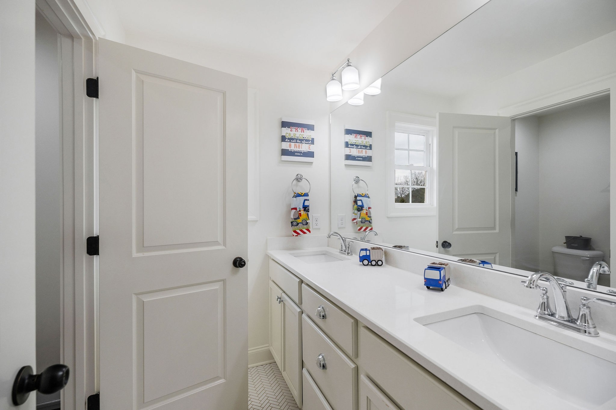 2945 Siegel Road Murfreesboro, TN 37129 - Photo 43 of 59 a bathroom with double vanity sink a mirror and shower