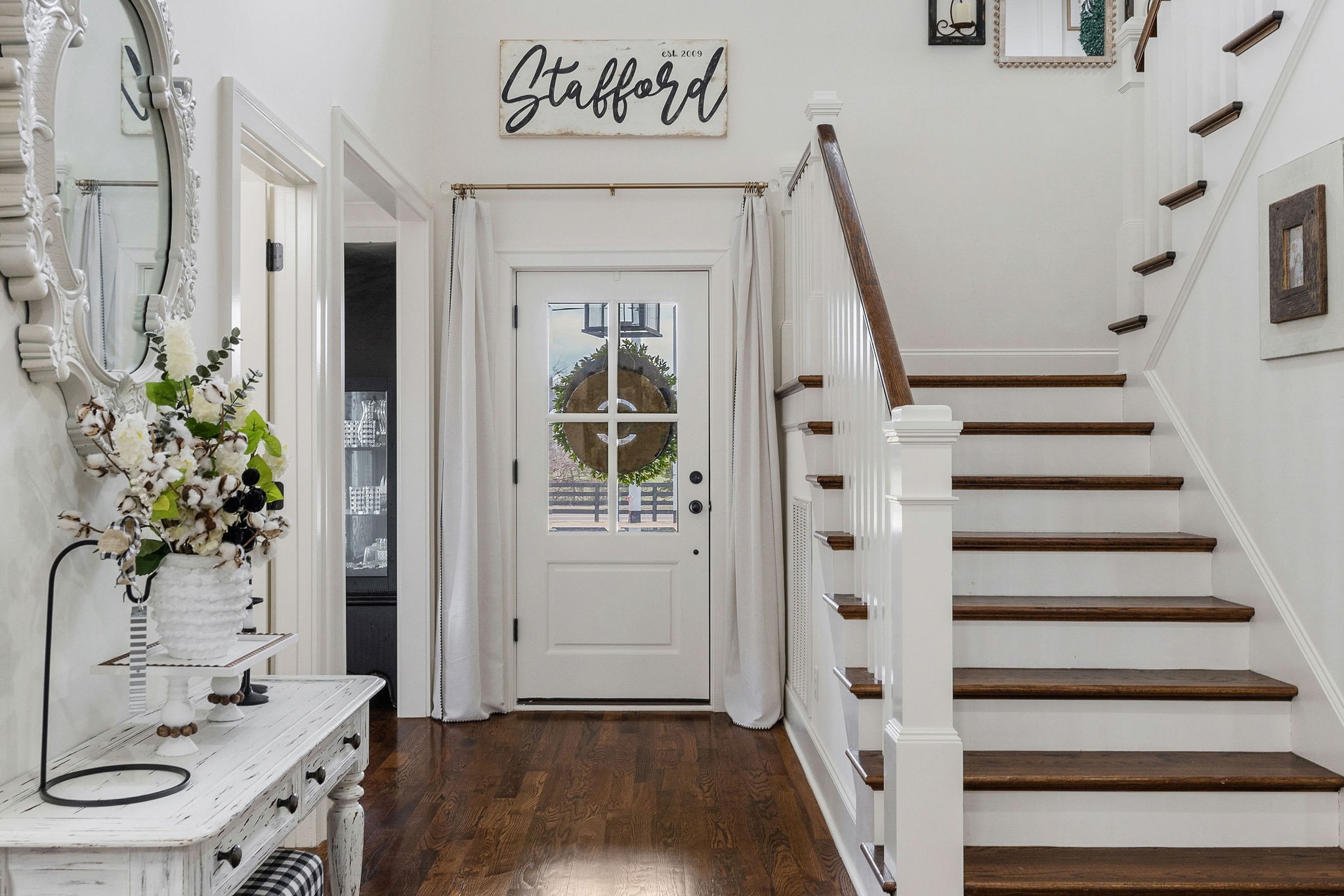 2945 Siegel Road Murfreesboro, TN 37129 - Photo 7 of 59 a view of a hallway with wooden floor and staircase