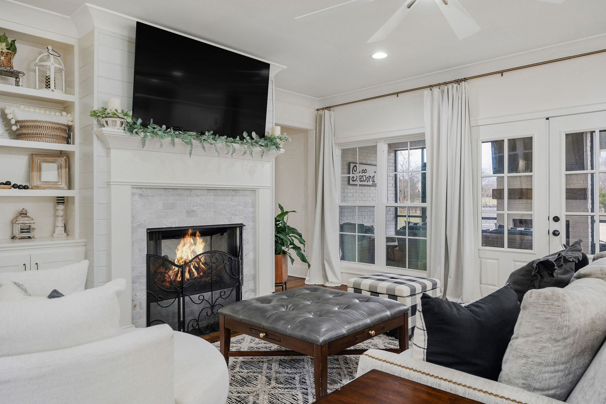 2945 Siegel Road Murfreesboro, TN 37129 - Photo 10 of 59 a living room with furniture a flat screen tv and a fireplace