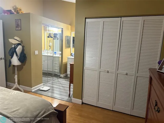 a bathroom with a sink vanity and mirror