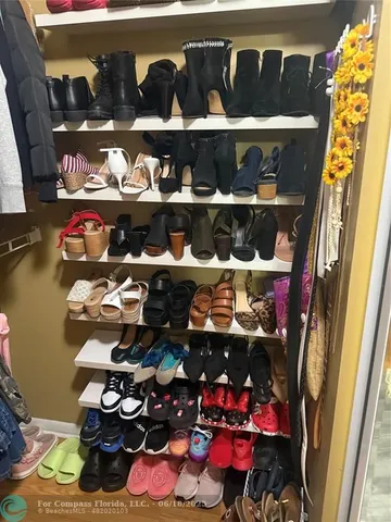 a bedroom with a bed and a mirror