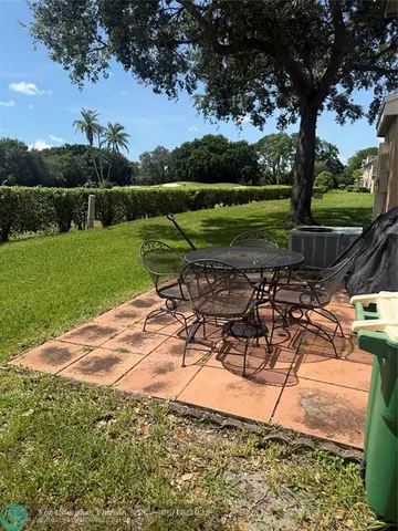 a view of a golf course with a lake
