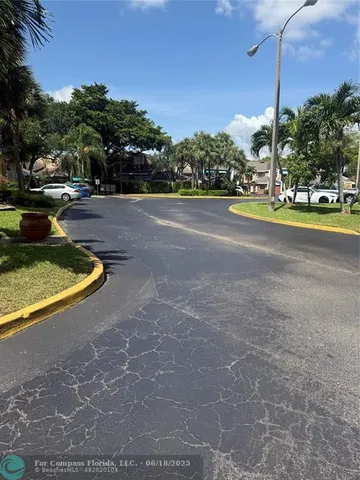 a view of street with large trees