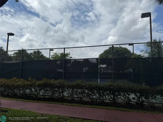 a kitchen with a sink a stove and cabinets