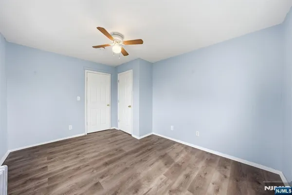 a bathroom with a toilet a sink and a window