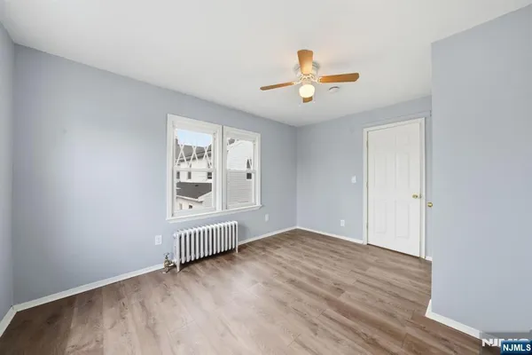 a bathroom with a bathtub a toilet a sink and a window