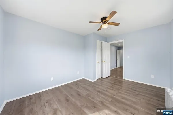 a view of a room with rack on the wall and a window