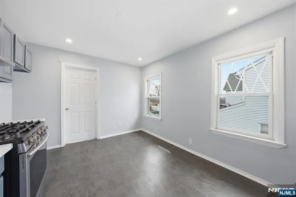 a kitchen with a stove and a refrigerator
