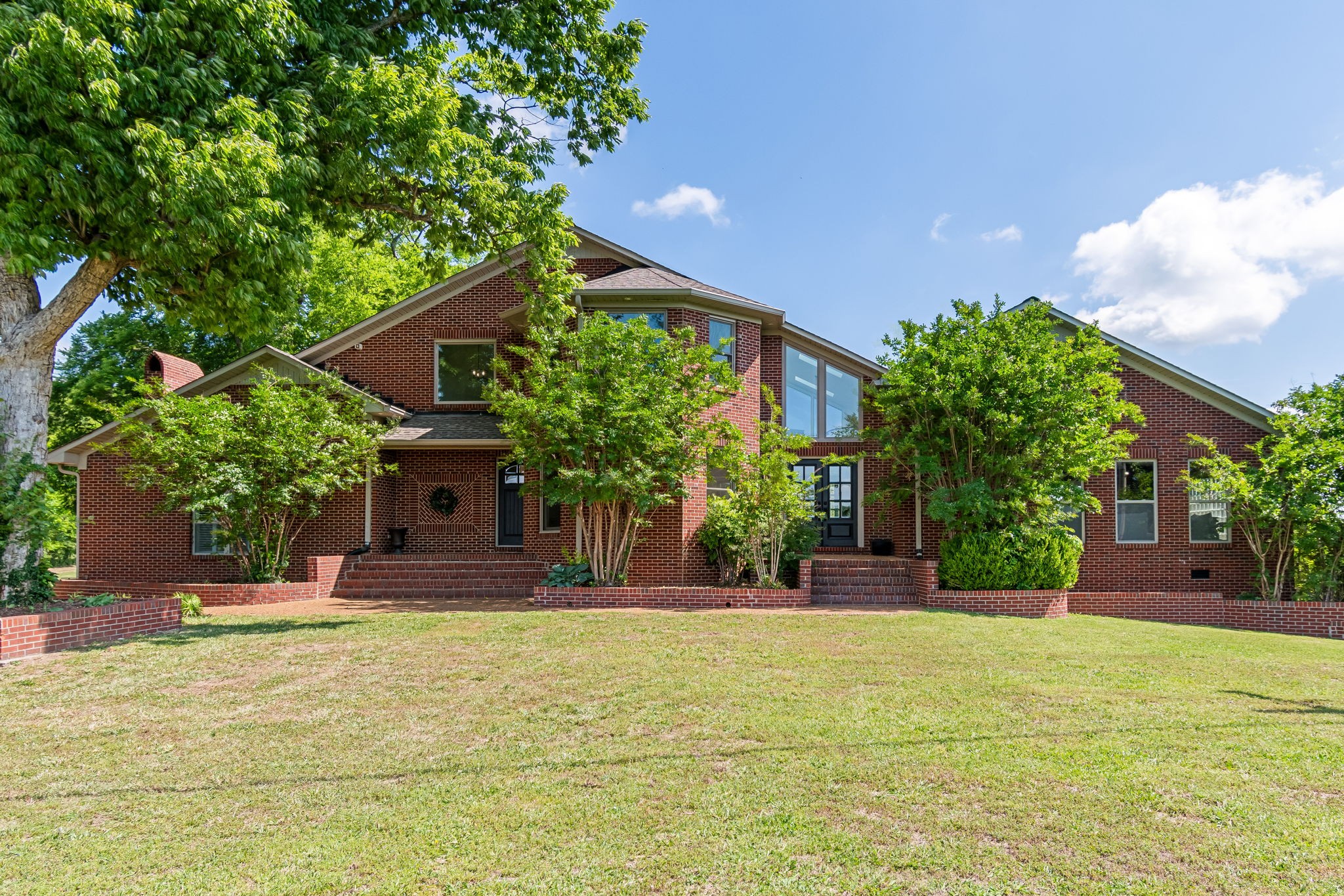 1979 Buck Daniels Road Culleoka, TN 38451 - Photo 1 of 61 a front view of a house with a yard