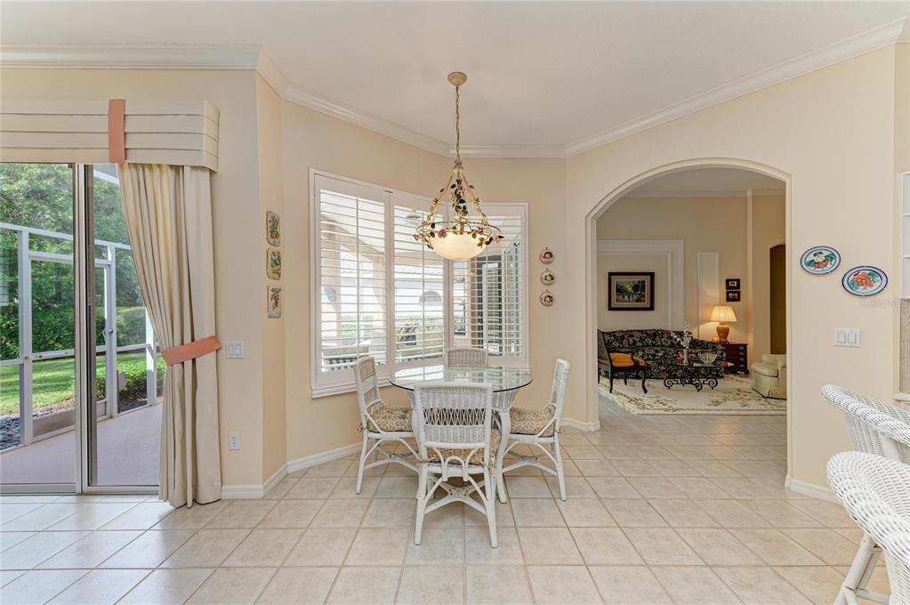 8122 Waterview Boulevard Lakewood Ranch, FL 34202 - Photo 18 of 54 a dining room filled with furniture and window