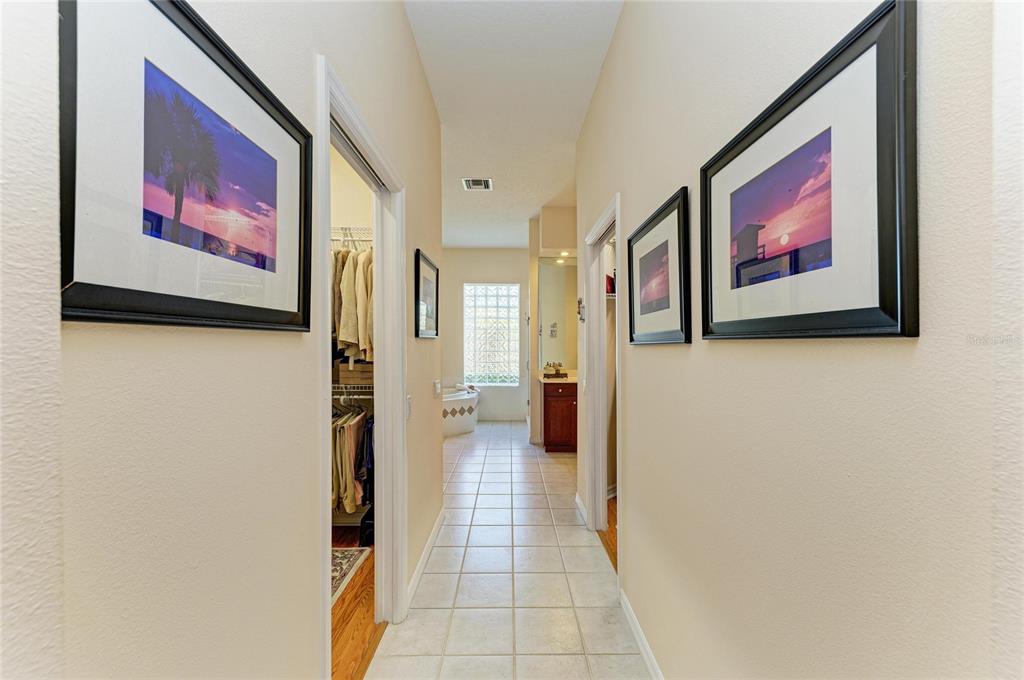8122 Waterview Boulevard Lakewood Ranch, FL 34202 - Photo 27 of 54 a view of a hallway with paintings on the wall