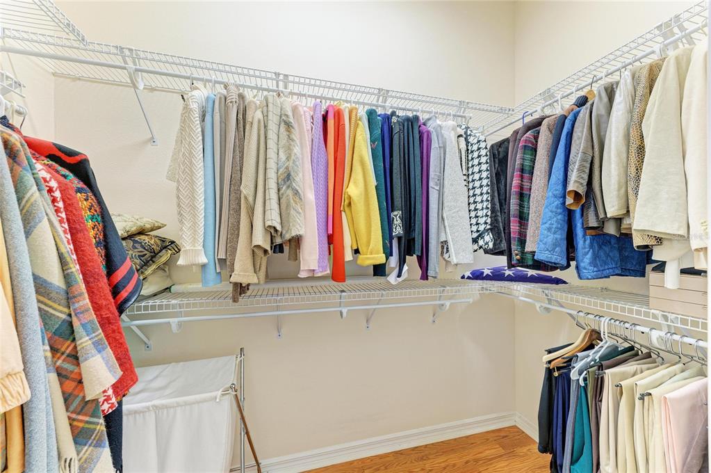 8122 Waterview Boulevard Lakewood Ranch, FL 34202 - Photo 28 of 54 a view of walk in closet with clothes and shoes