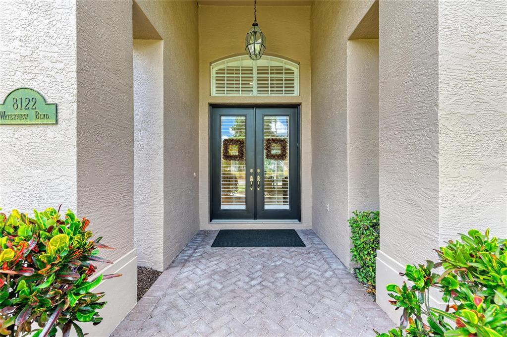 8122 Waterview Boulevard Lakewood Ranch, FL 34202 - Photo 5 of 54 a front view of a house with a pathway