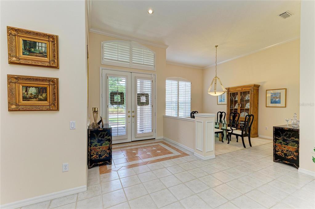 8122 Waterview Boulevard Lakewood Ranch, FL 34202 - Photo 7 of 54 a living room with furniture and a table