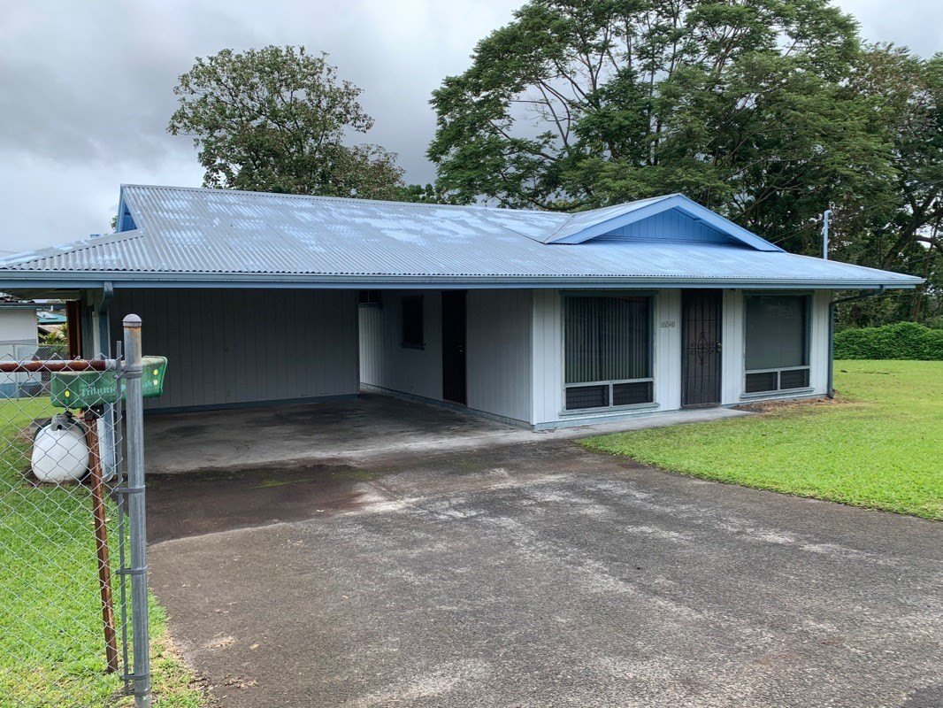 16-555 Old Volcano Road Keaau, HI 96749 - Photo 1 of 15 a front view of a house with garden