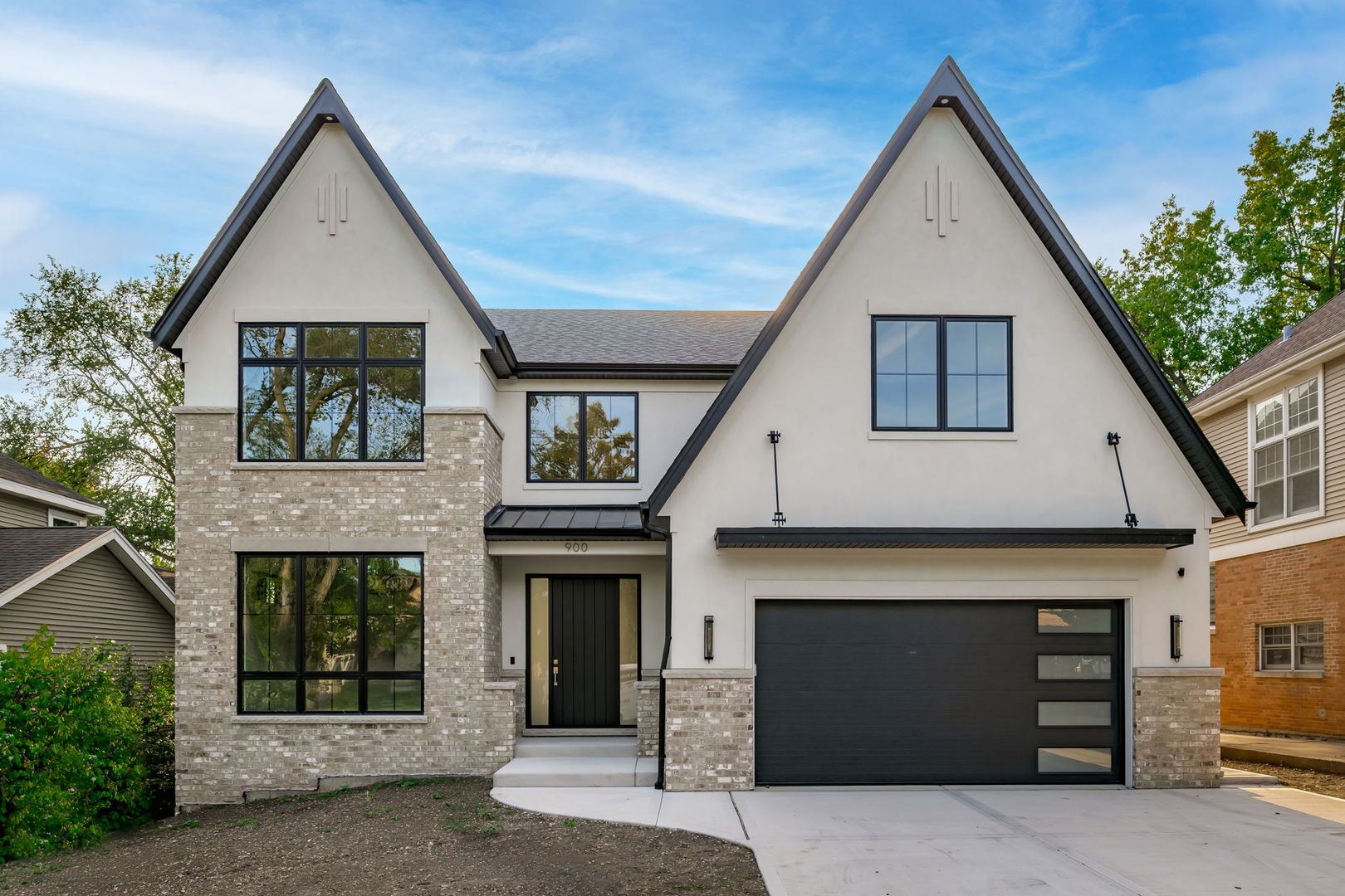 a front view of a house with garage