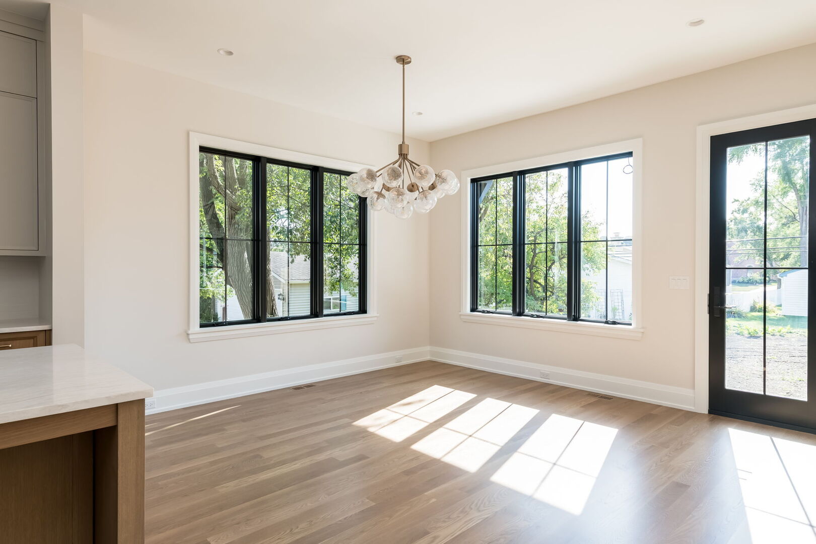 900 Colfax Avenue Elmhurst, IL 60126 - Photo 14 of 43 a view of an empty room with wooden floor and a window