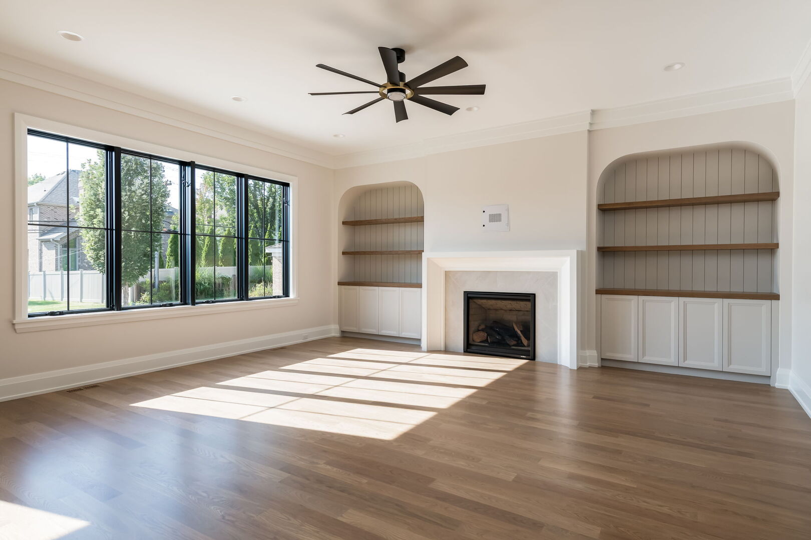 900 Colfax Avenue Elmhurst, IL 60126 - Photo 15 of 43 a view of an empty room with a fireplace and a window