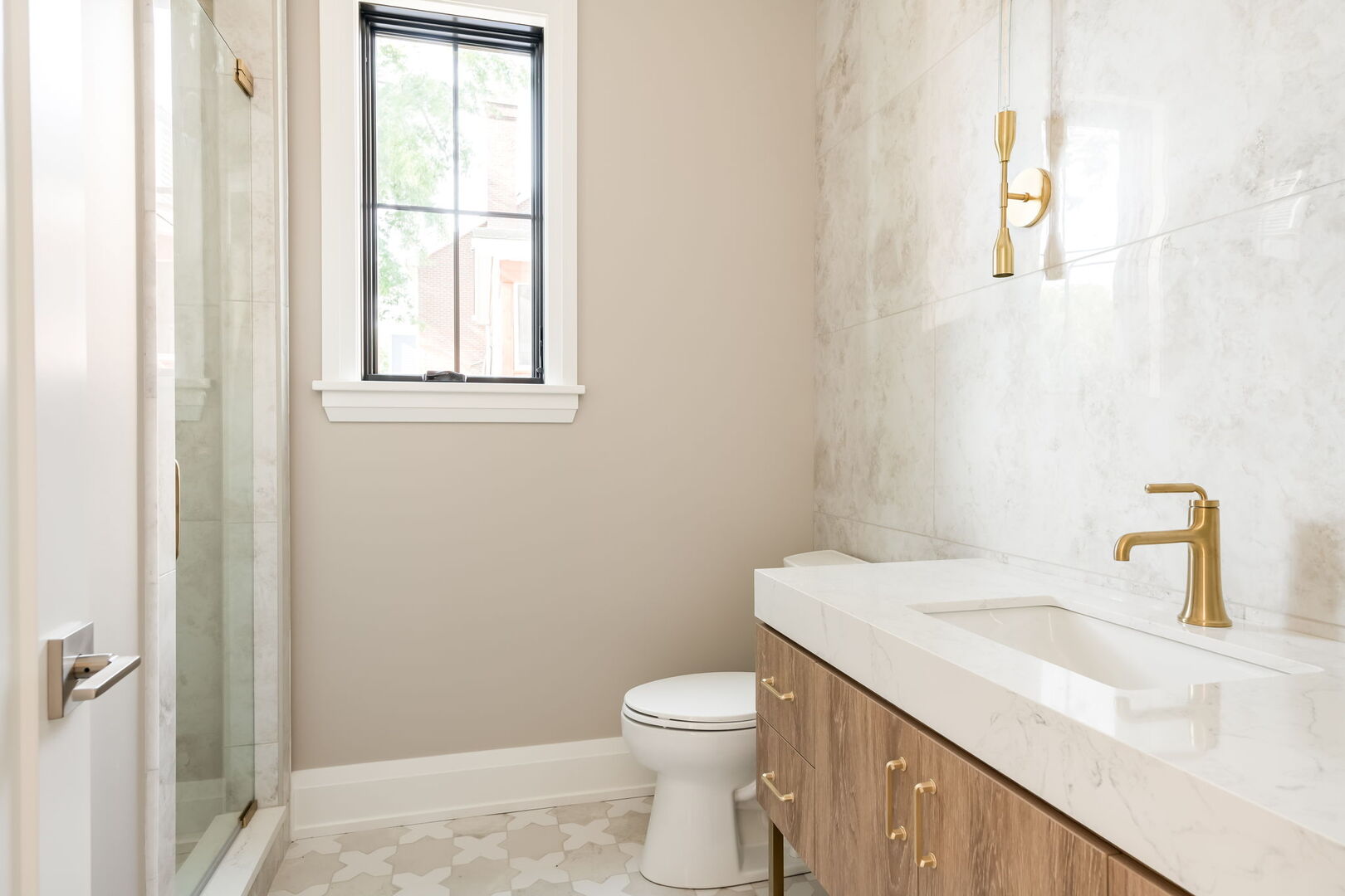 900 Colfax Avenue Elmhurst, IL 60126 - Photo 17 of 43 a bathroom with a granite countertop toilet a sink and a window