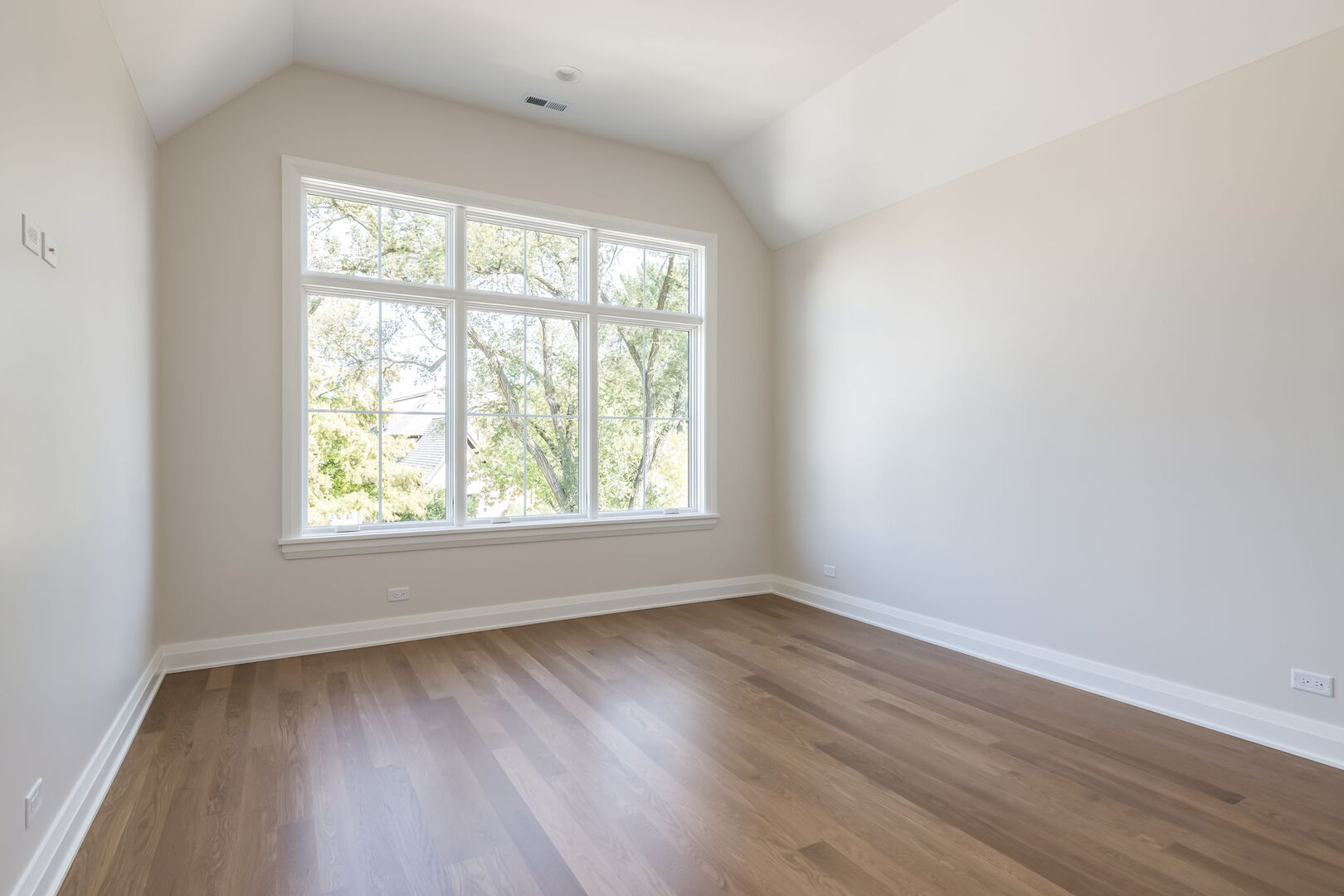 900 Colfax Avenue Elmhurst, IL 60126 - Photo 31 of 43 an empty room with wooden floor and windows