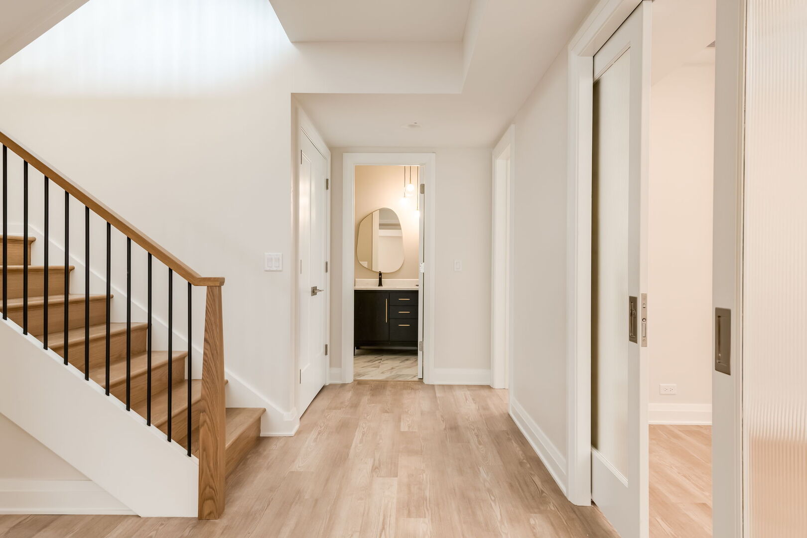 900 Colfax Avenue Elmhurst, IL 60126 - Photo 33 of 43 a view of a hallway with wooden floor and stairs