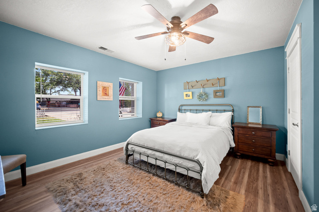 236 West 300 South Hurricane, UT 84737 - Photo 27 of 76 Spacious room featuring wood-finish flooring, light blue walls, and white trim