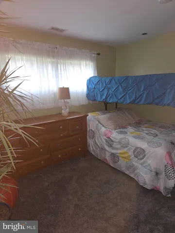 a room with a bed and window