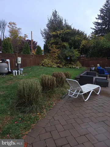 a view of a table and chairs in the garden