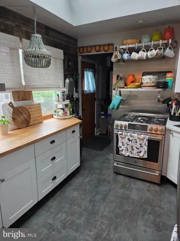 a kitchen with a stove and cabinets