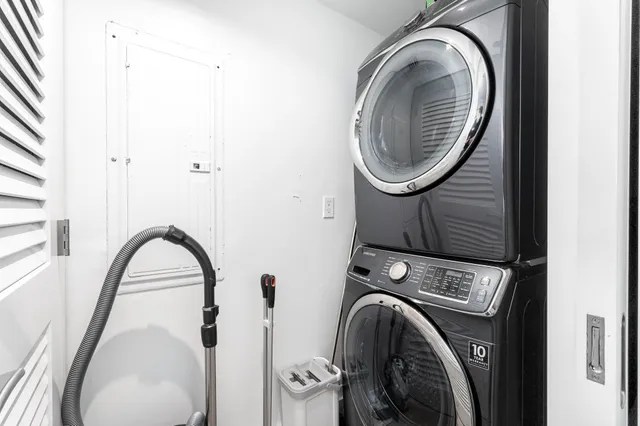 a close view of a utility room with dryer and washer