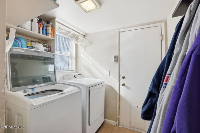 a view of storage and utility room with washer and dryer