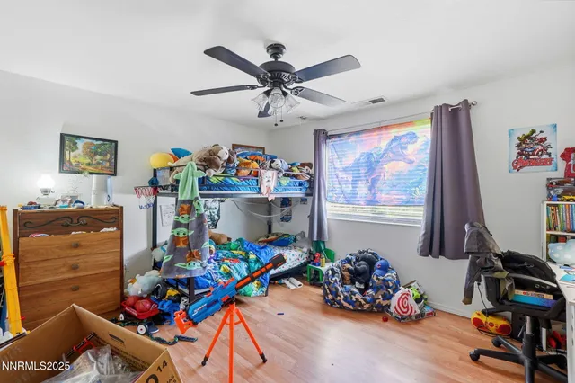 a room with toys and a wooden floor