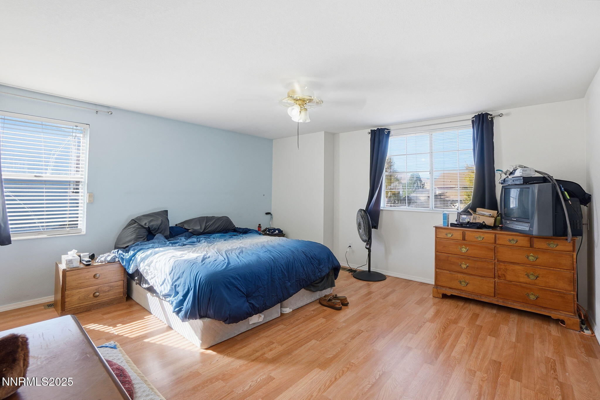 8486 Piper Place Reno, NV 89506 - Photo 18 of 25 a bed room with a bed and a dresser