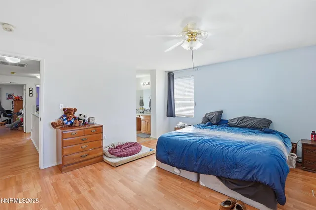 a bedroom with bed and window