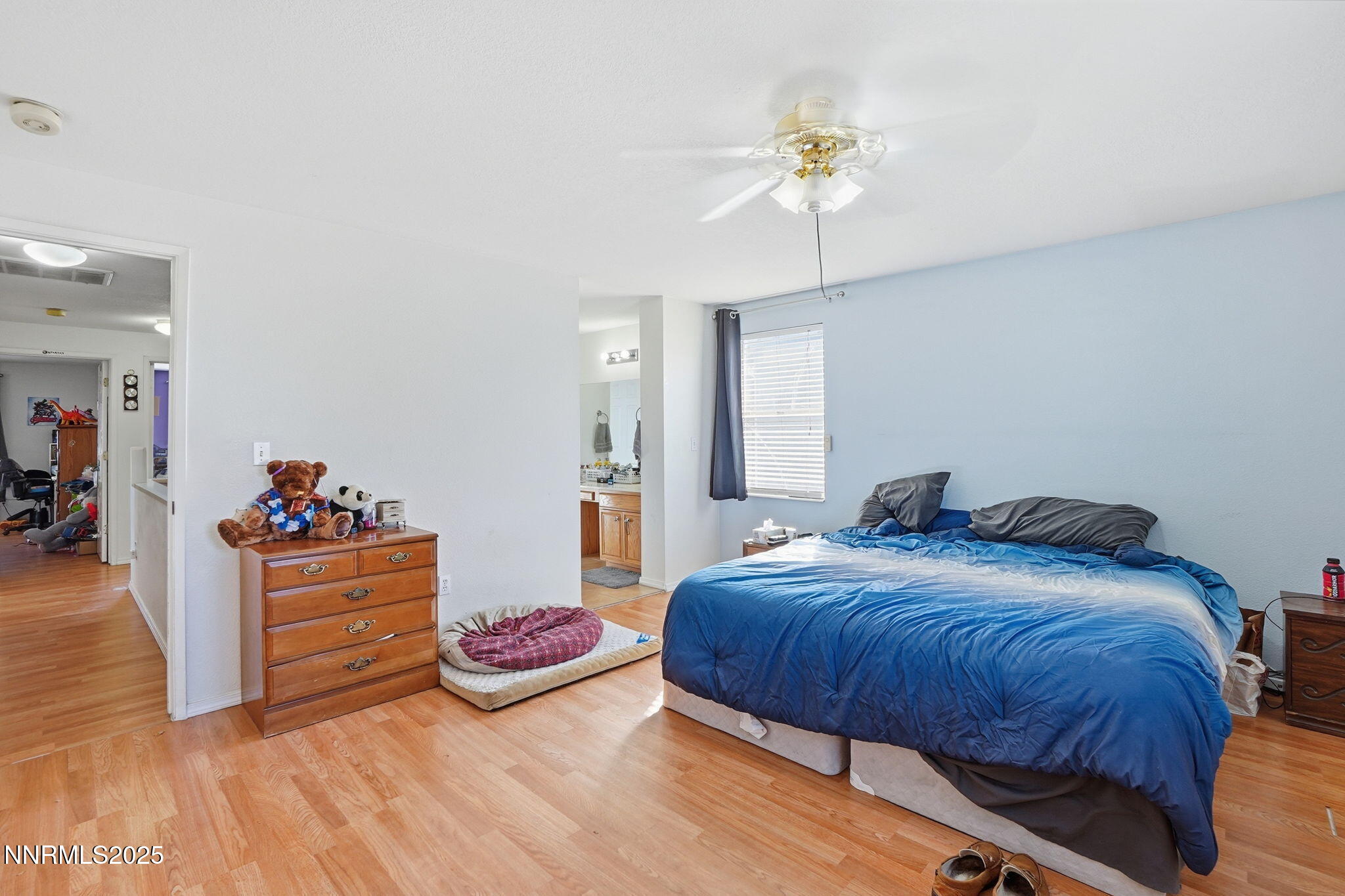 8486 Piper Place Reno, NV 89506 - Photo 19 of 25 a bedroom with bed and window