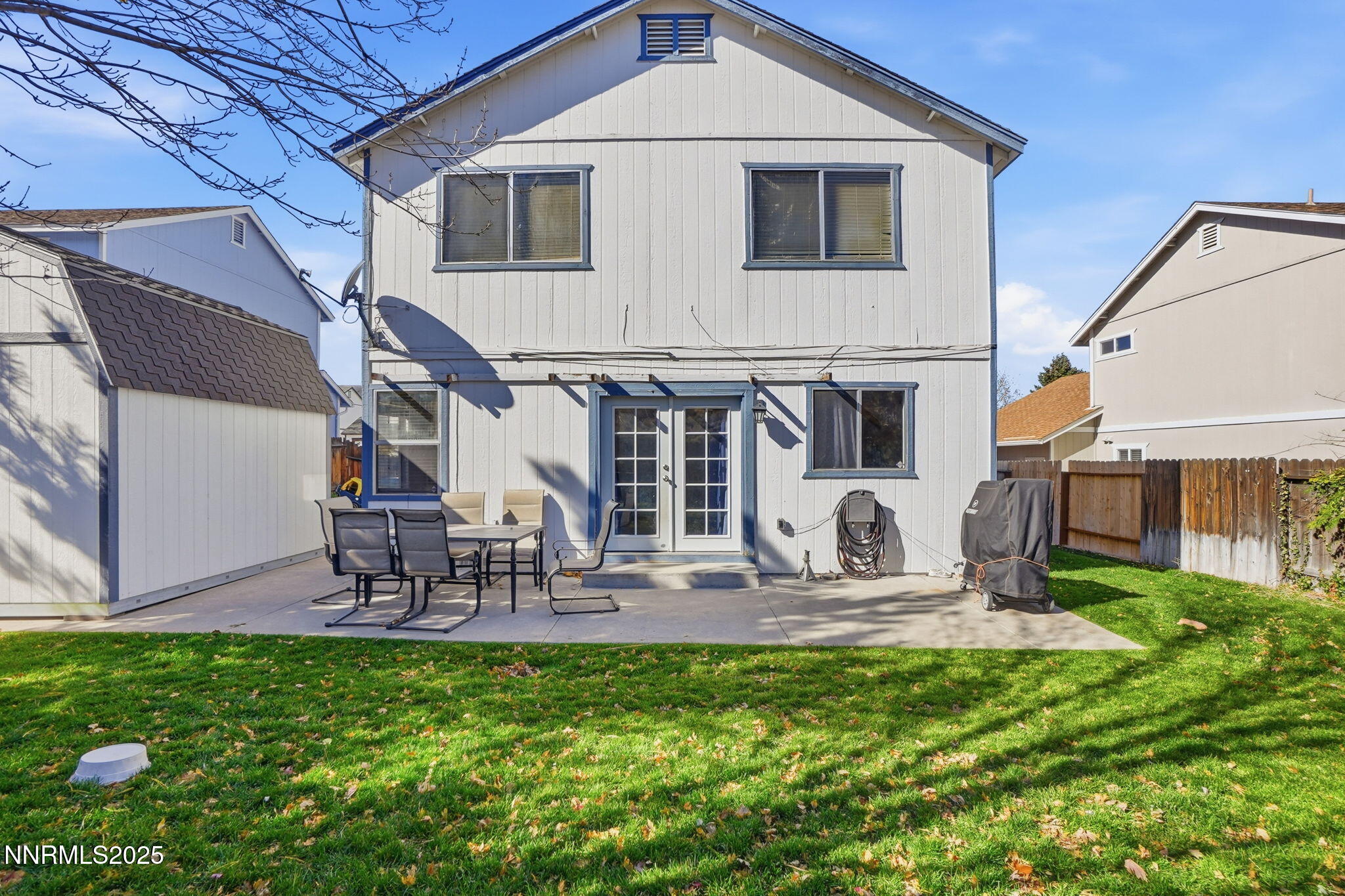 8486 Piper Place Reno, NV 89506 - Photo 23 of 25 a front view of house with a garden and patio