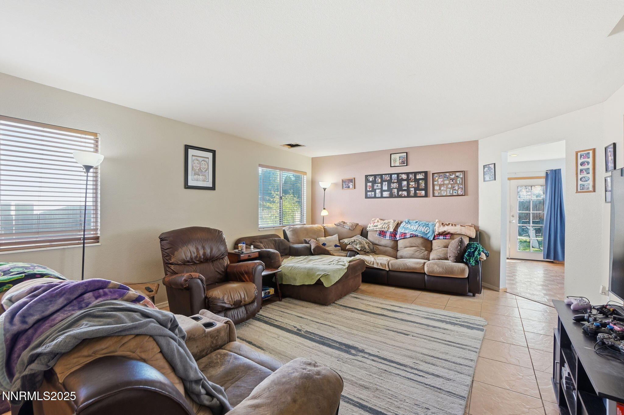 8486 Piper Place Reno, NV 89506 - Photo 5 of 25 a living room with furniture or couch and a window