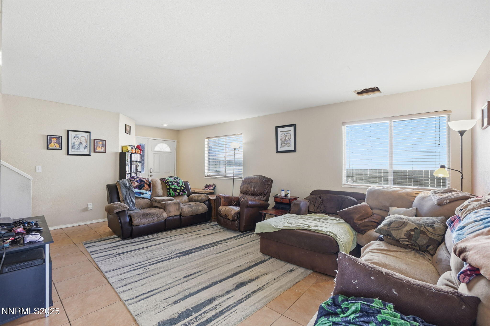 8486 Piper Place Reno, NV 89506 - Photo 6 of 25 a living room with furniture and a couch