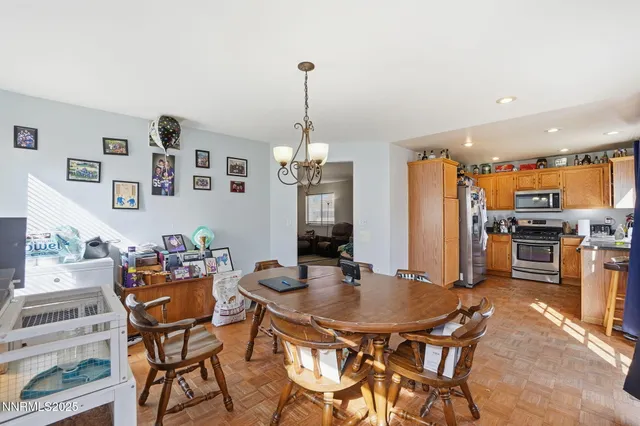 a dining room with furniture and window