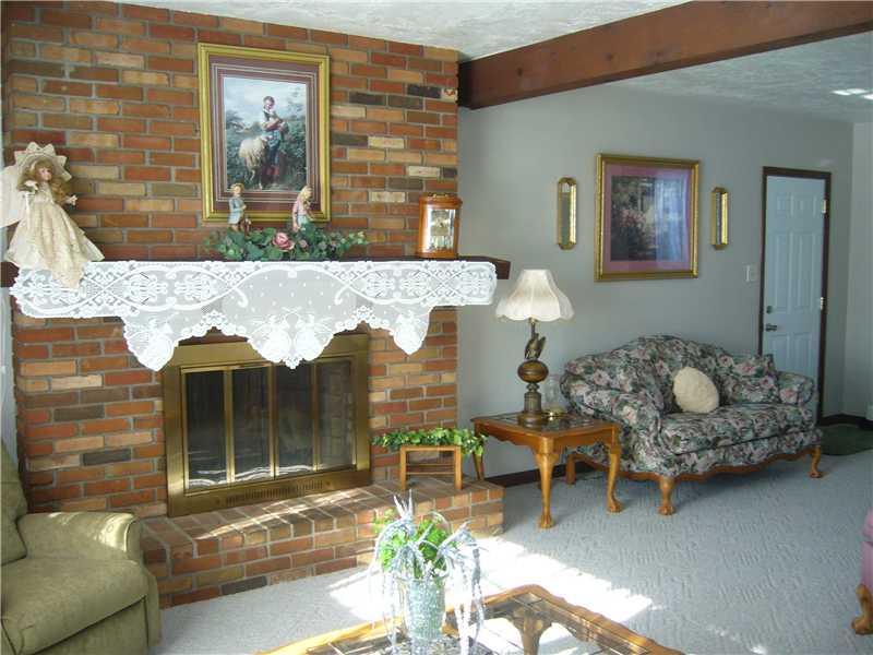 166 Steel School Road Freedom, PA 15042 - Photo 4 of 12 Family Room. Walk right into a SPACIOUS family room, wood burning fireplace, 1/2 bath, garage and basement access.