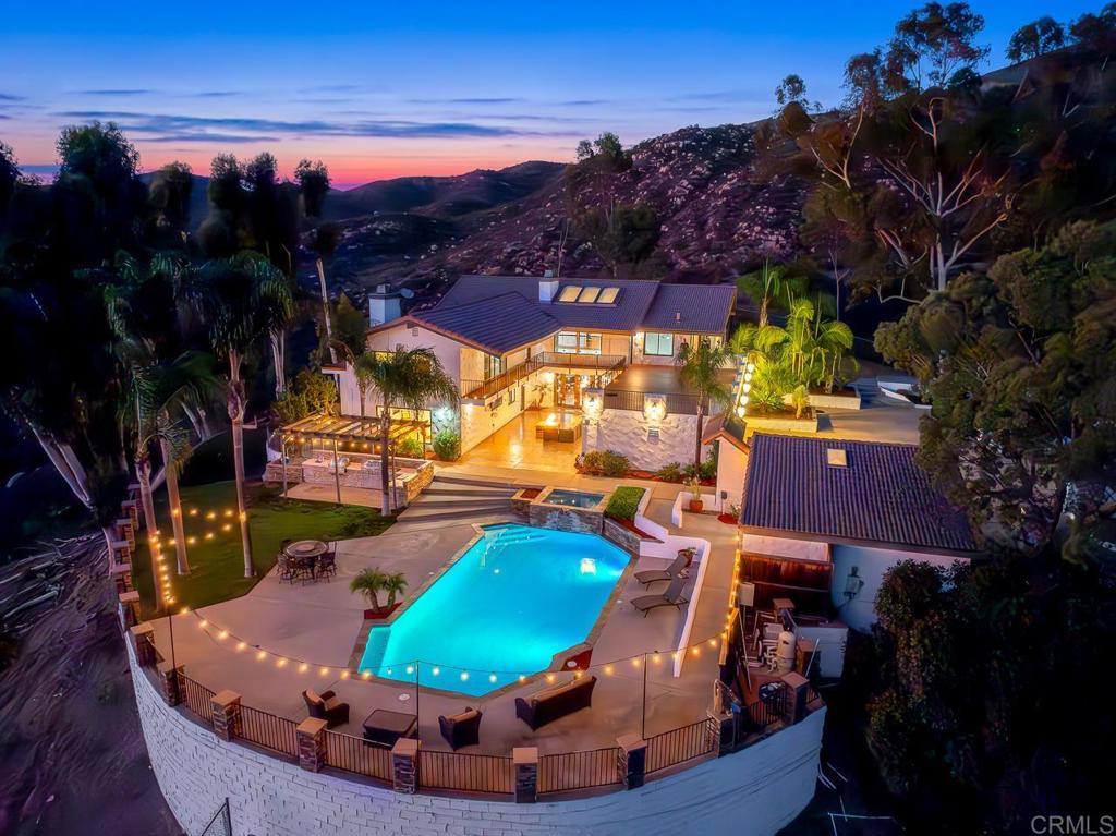 a view of a swimming pool with an outdoor seating