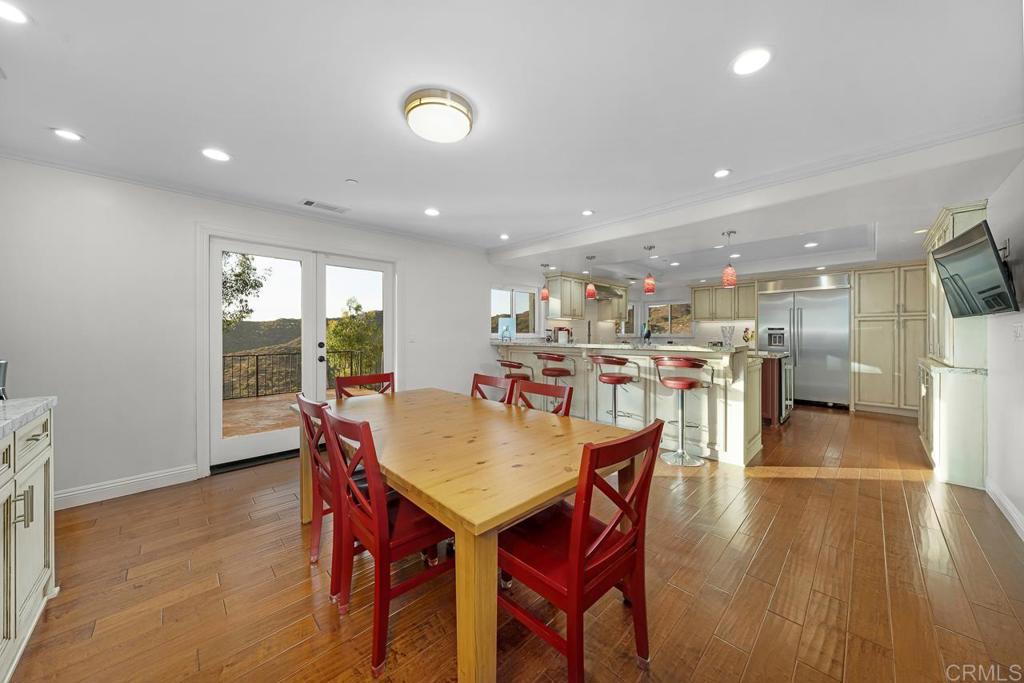 14062 Jamacha Hills Road Jamul, CA 91935 - Photo 13 of 39 a dining room with furniture and wooden floor