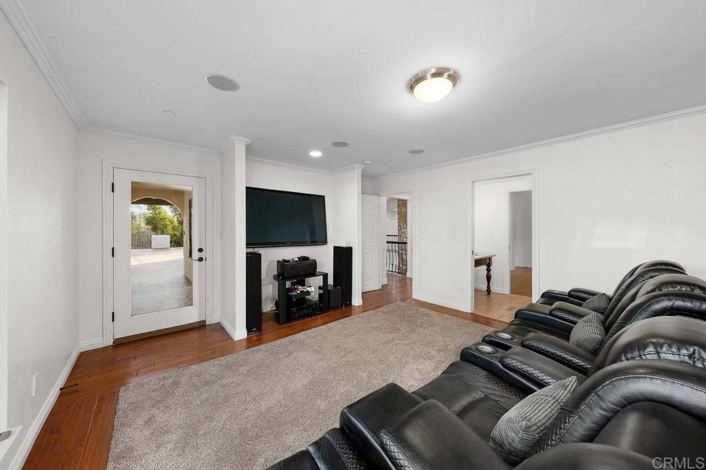 14062 Jamacha Hills Road Jamul, CA 91935 - Photo 15 of 39 a bedroom with furniture and a flat screen tv