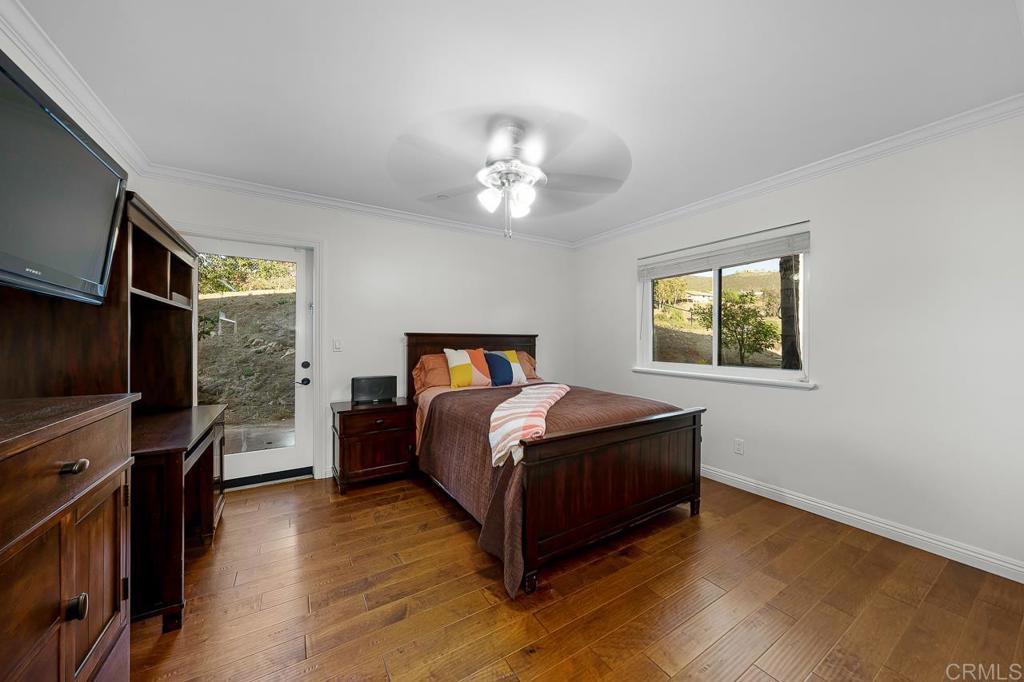 14062 Jamacha Hills Road Jamul, CA 91935 - Photo 17 of 39 a bed room with a bed and a window